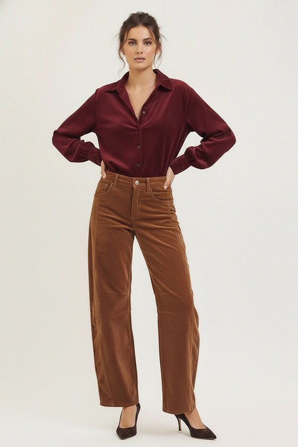 Woman wearing burgundy satin blouse and brown wide-leg pants, shahida uae