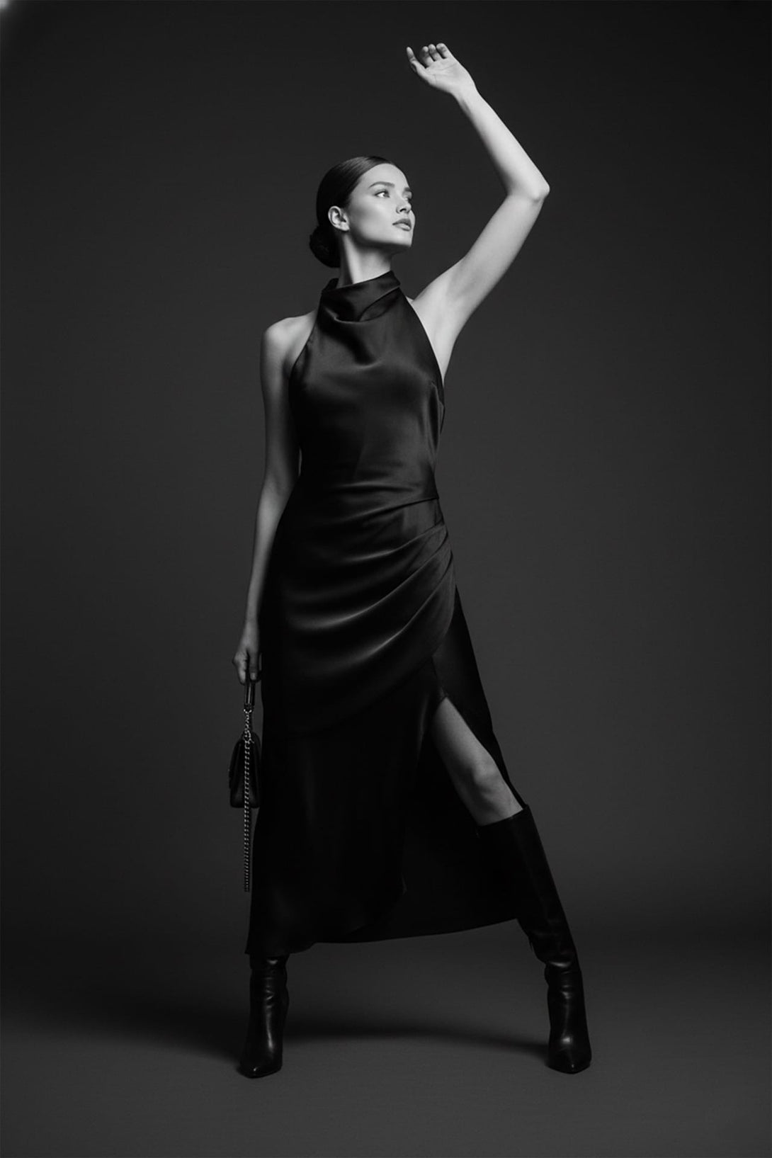 Shahida Parides,
halter neckline party dress,
fitted black midi dress,
curve-hugging bodycon silhouette,