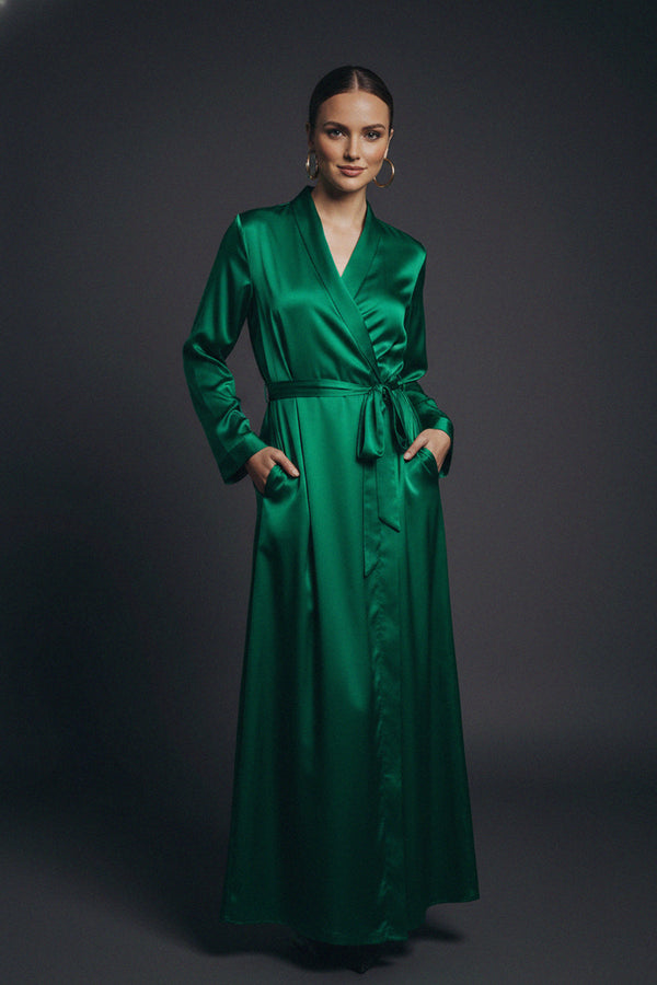 emerald wrap dress, satin maxi dress, green evening gown, belted long dress, luxury fashion, elegant style, women’s fashion, Shahida Parides, formal wear, silk look dress, chic outfit, timeless elegance