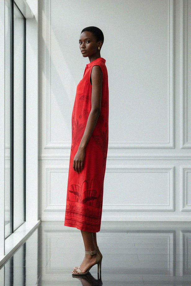 Shahida Parides red midi dress featuring intricate tonal print worn by model in left pose showing sleeveless collared design for luxury resort and cocktail style