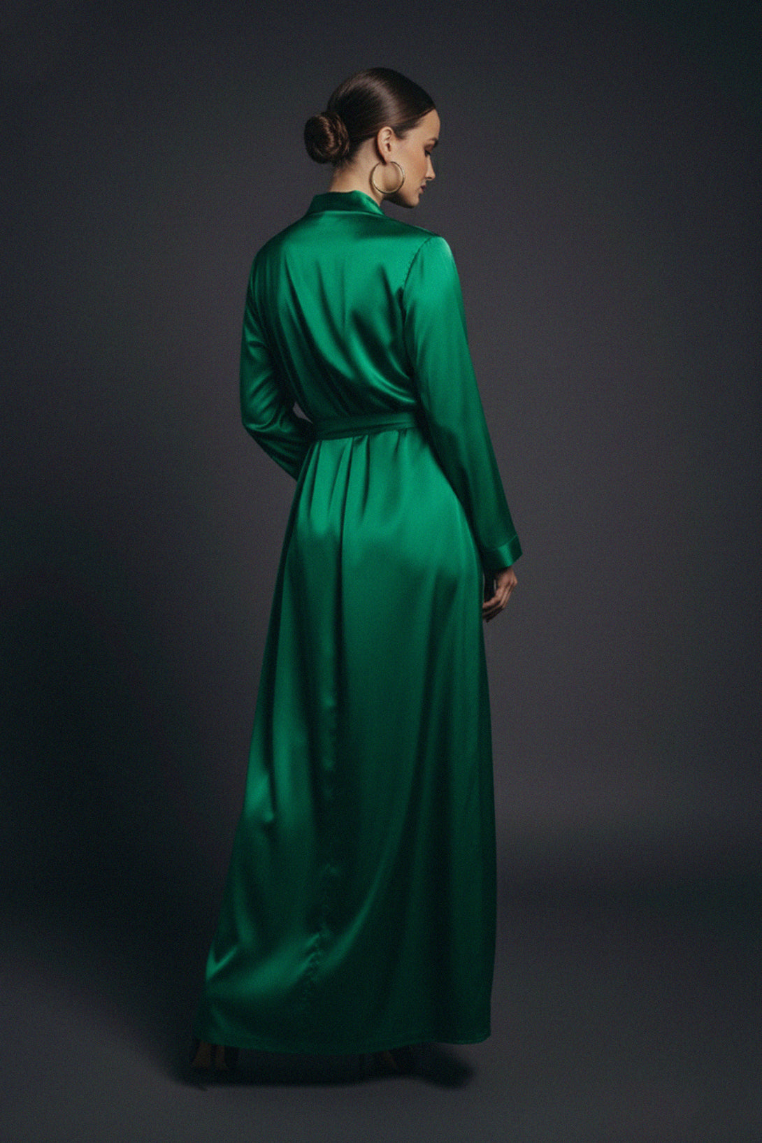 Shahida Parides gown, satin wrap dress, emerald fashion, back profile look, elegant evening gown, luxury style, formal green dress, silk maxi outfit, chic women’s wear, satin texture, fashion glamour, refined design