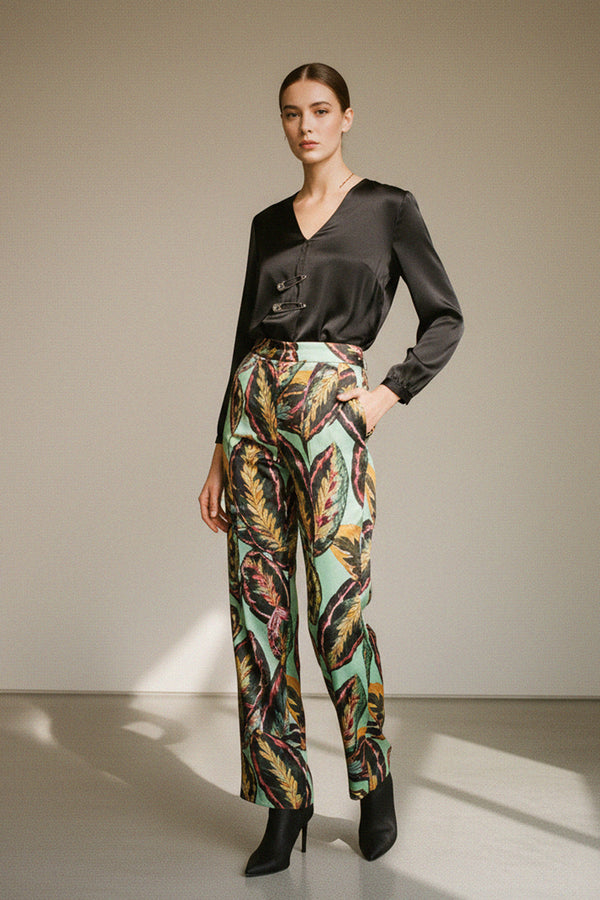 stylish-trousers, leaf-print-pants, high-waist-design, black-satin-blouse, trendy-fashion, bold-print-outfit, chic-style, fashion-forward-women