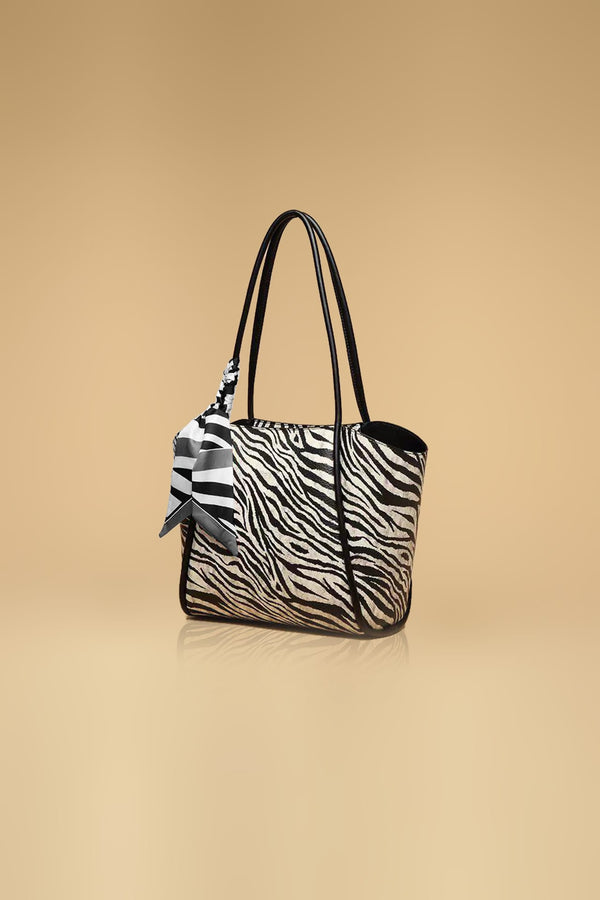 Elegant Zebra Print Handbag With A Stylish Bow