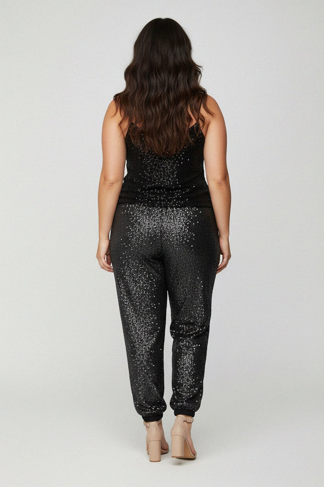 sparkle crop top, chic evening outfit, luxury curvy style, glamorous black top, sequin event wear, holiday fashion