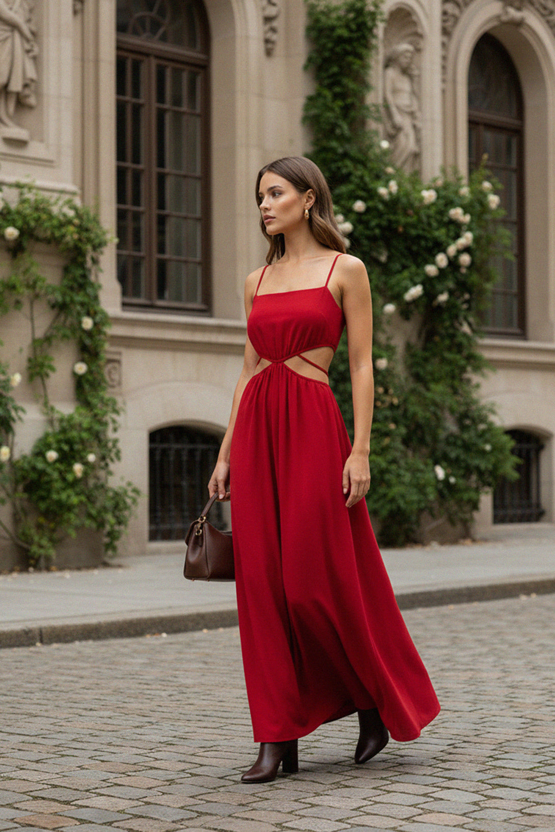 Chic red dress featuring spaghetti straps and waist cutout details, ideal for parties and vacation styling.