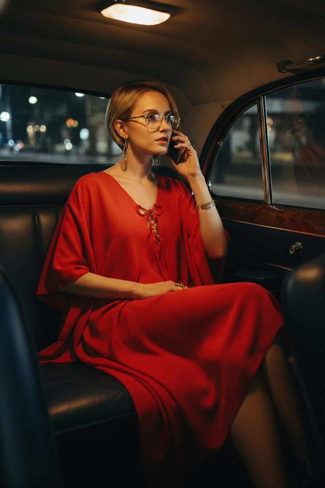 Chic red V-neck midi dress styled for a night-out look
